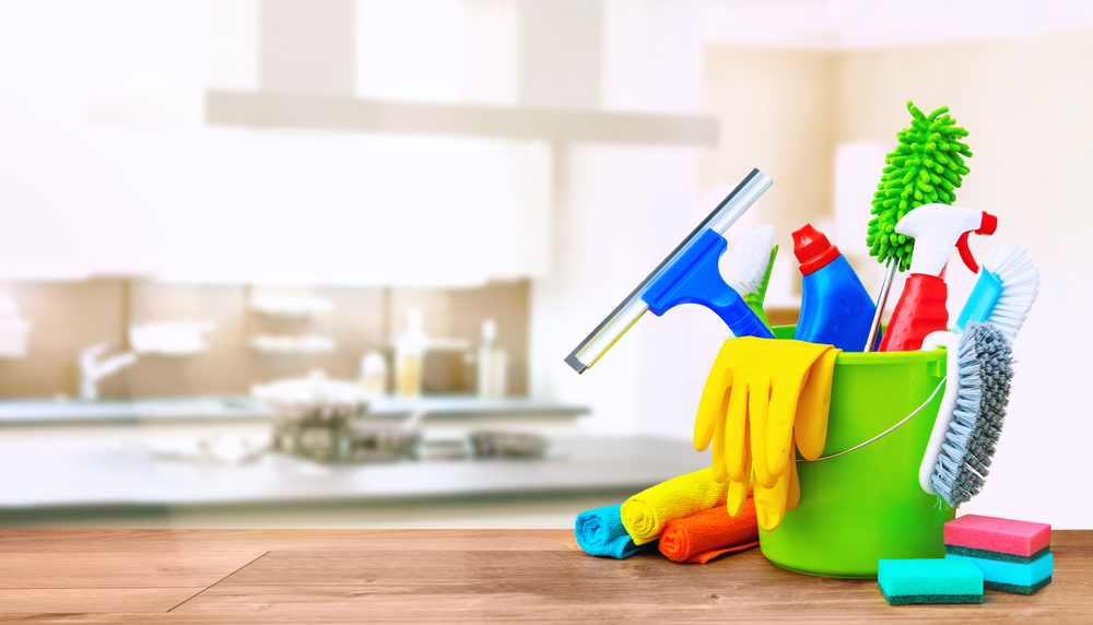 cleaning,items,in,a,bucket,on,a,wooden,table,infront