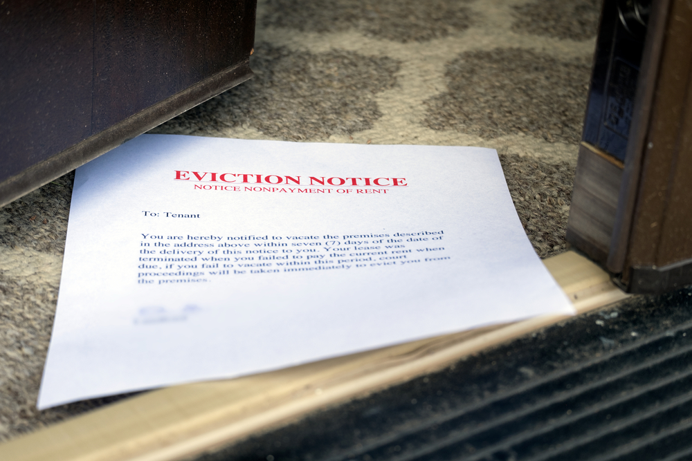 eviction,notice,(on,the,floor),slipped,under,opened,entrance,door